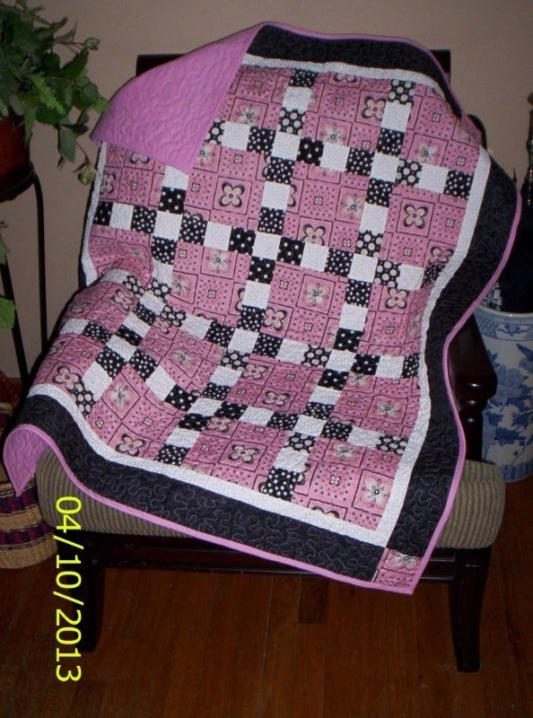 Pink and black baby quilt