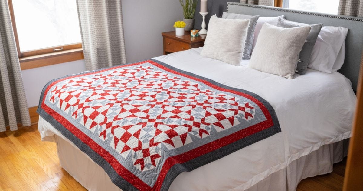 The Fourth 2023 AQS & AccuQuilt-Along Series is the GO! Shoo Fly Spin Throw Quilt