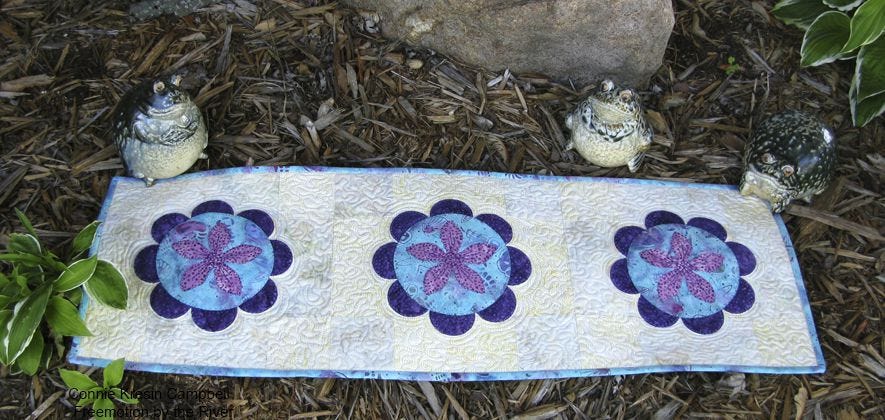 Table runner outside with some frogs