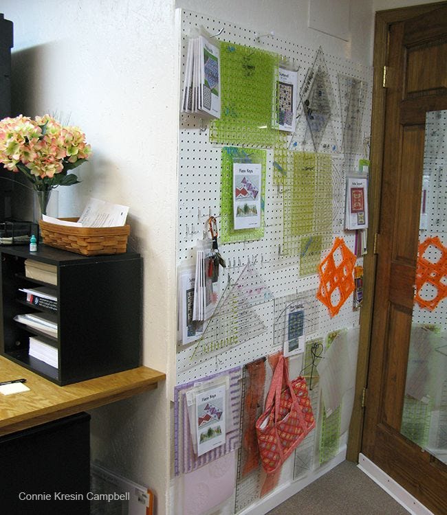 Rulers and templates hanging on pegboard