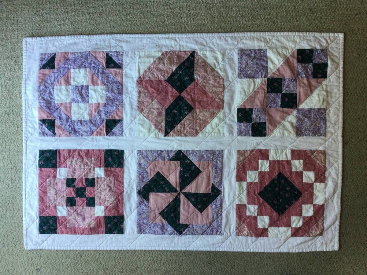 Quilt made with old Block of the Month Blocks