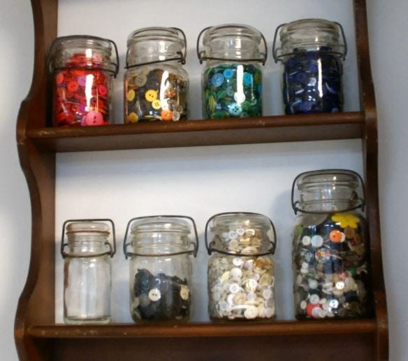 Button jars organized by color