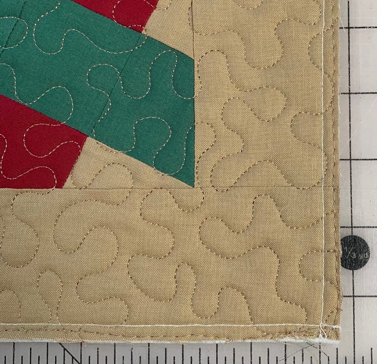 Close Up of the Sewn and Quilted Front of the Holiday Washington's Puzzle Pillow Cover