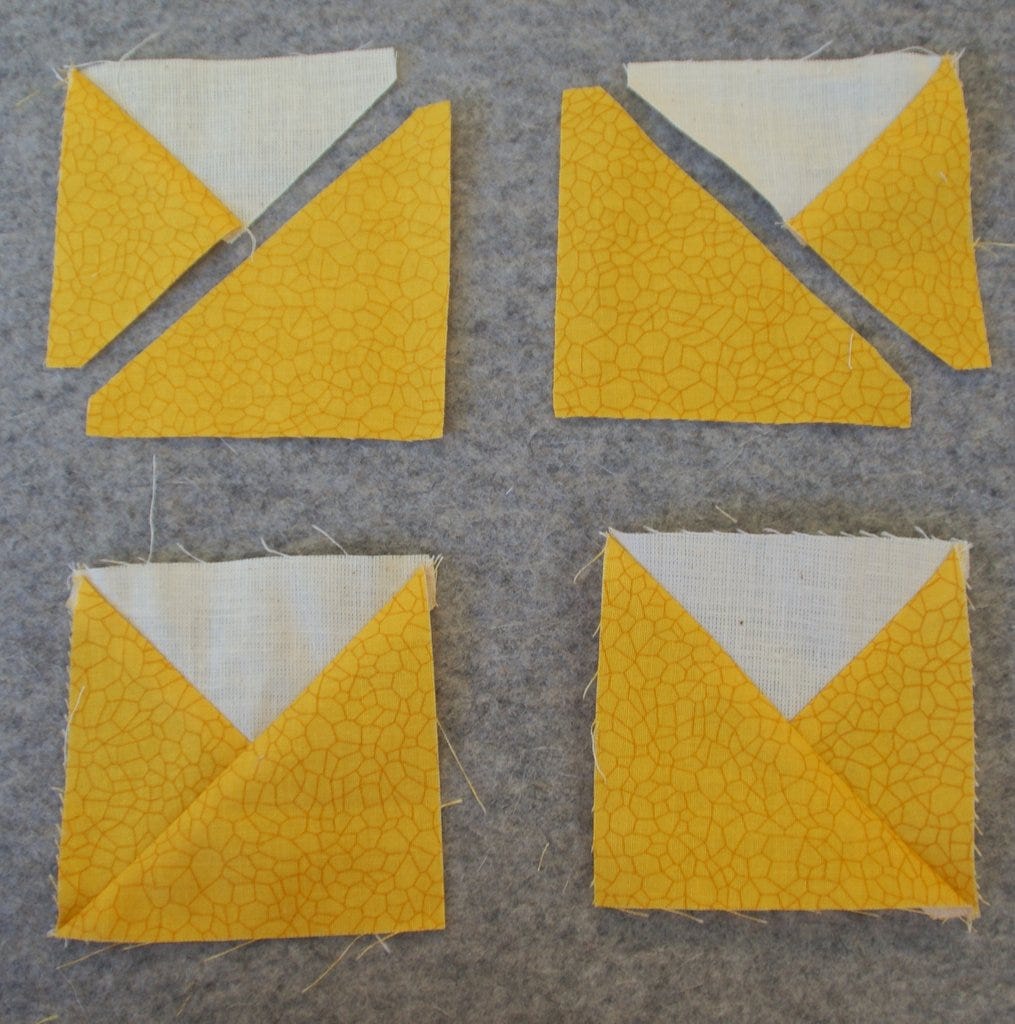 white triangle with yellow triangles as sunflower petal blocks sewn