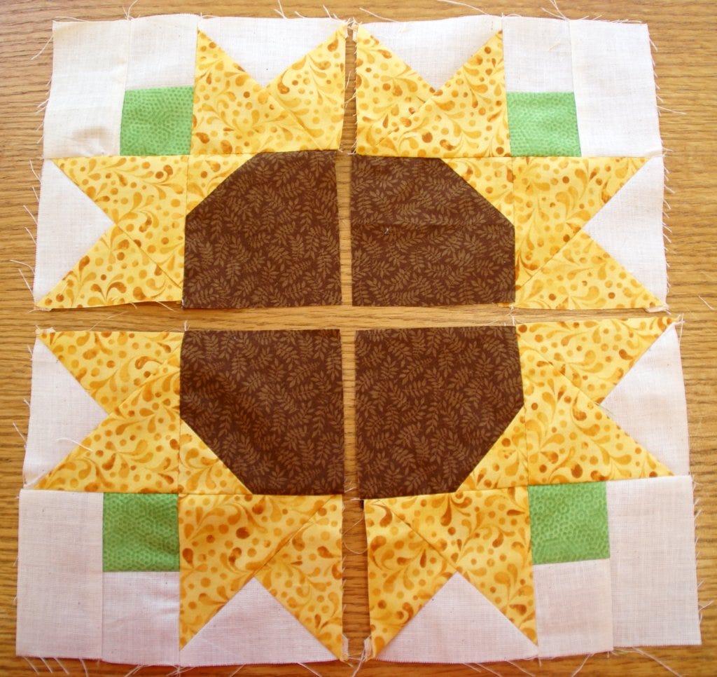 sunflower block sewn into squares and laid out before sewing