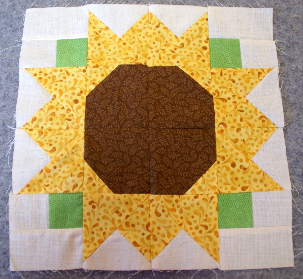 sewn sunflower block on wool mat
