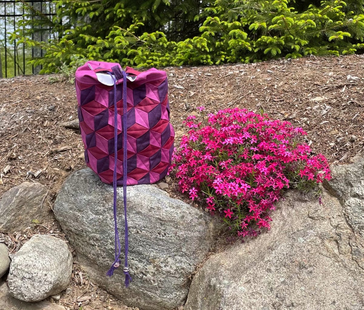 Jen's Finished Weaved Drawstring Bucket Bag Pictured with Flowers