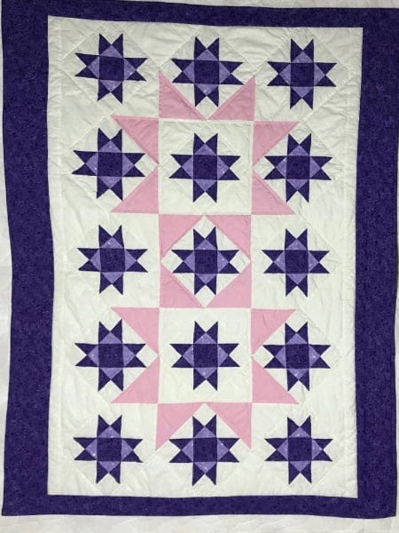 Gail W. L.'s GO! Stars in the Crown Throw Quilt