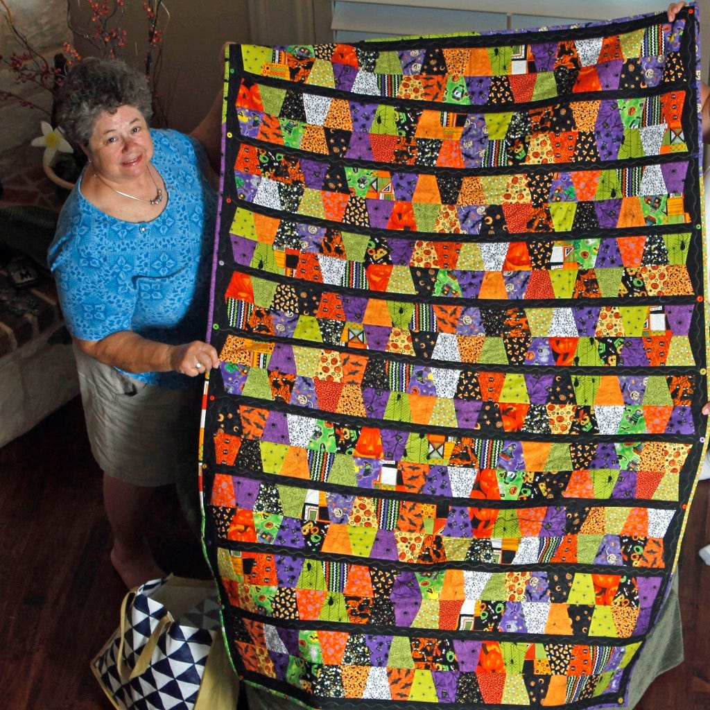 Mary with her Halloween Tumbler Quilt