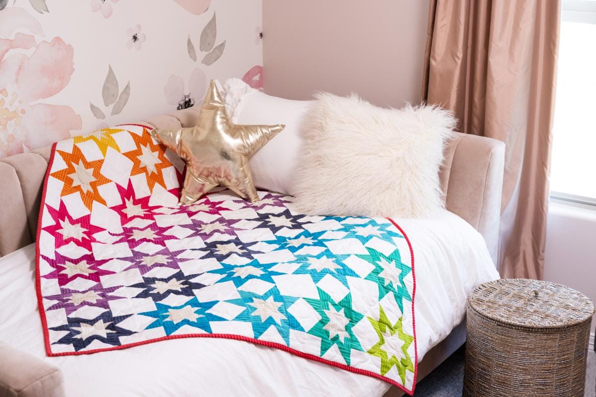 PQ11953 Rainbow Rising Throw Quilt_lifestyle_hor_HQ (1)-1