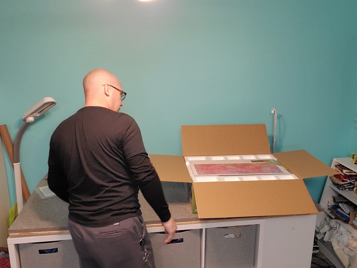 Andrew opens the box and realizes how much in included in the Ready. Set. GO! fabric cutting system