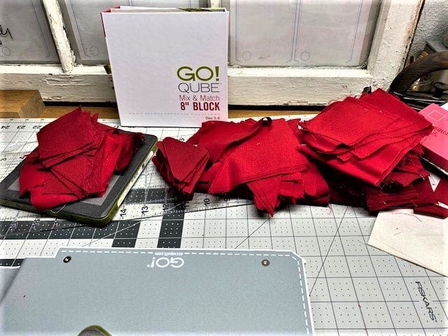 Red Scraps with Part of the GO! Qube Mix & Match 8" Block and GO! Fabric Cutter